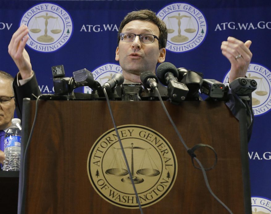 Washington Attorney General Bob Ferguson talks to reporters, Monday, Jan. 30, 2017, in Seattle. Ferguson announced that he is suing President Donald Trump over an executive order that suspended immigration from seven countries with majority-Muslim populations and sparked nationwide protests. (AP Photo/Ted S. Warren)
