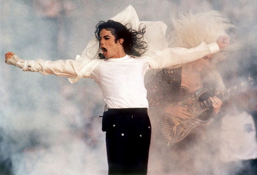 Michael Jackson - Super Bowl XXVII (1993) Pop star Michael Jackson performs during the Super Bowl XXVII halftime show in Pasadena, Calif., Jan. 31, 1993. (AP Photo/Rusty Kennedy)