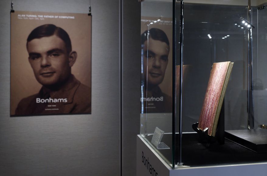 In this Thursday, March 19, 2015, file photo, a notebook of British mathematician Alan Turing is displayed in front of his portrait during an auction preview in Hong Kong. Thousands of men convicted under now-abolished anti-homosexuality laws in Britain have been pardoned posthumously under a law passed on Tuesday, Jan. 31, 2017, and many more still alive can now apply to have their criminal convictions wiped out. Calls for a general pardon have noted the 1954 suicide of World War II codebreaking hero Alan Turing after his conviction for &quot;gross indecency.&quot; After he received a posthumous royal pardon in 2013, pressure for pardons intensified. (AP Photo/Kin Cheung, file)