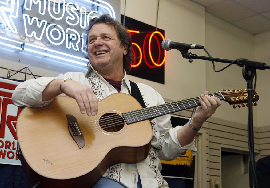 In this Thursday, April 17, 2008, file photo, John Wetton performs with the band Asia at a music store in New York. A statement from his publicist, Glass Onyon PR, says Wetton, 67, died Tuesday, Jan. 31, 2017, from colon cancer. (AP Photo/Jason DeCrow, file)