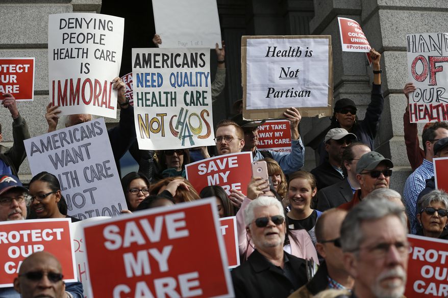 Supporters of the Affordable Care Act, who are also opponents of Colorado&#39;s GOP-led plan to undo Colorado&#39;s state-run insurance exchange, gather for a rally on the state Capitol steps in Denver, Tuesday, Jan. 31, 2017. The state GOP measure, a bill which would dismantle Connect For Health Colorado within a year, is an indication of how Republicans plan to chip away at Obamacare. If the federal health care law remains unchanged, it would force Coloradans shopping for private insurance to use the federal exchange. (AP Photo/Brennan Linsley)