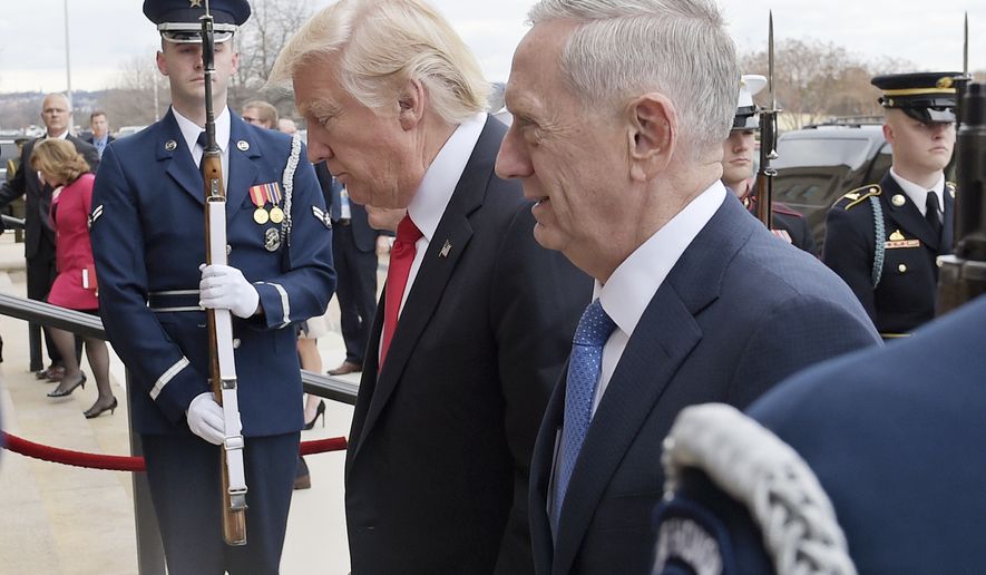 FILE - In this Jan. 27, 2017, file photo, U.S. Defense Secretary Jim Mattis, right, and U.S. President Donald Trump walk into the Pentagon in Washington. Mattis is making his debut with a visit to staunch U.S. allies South Korea and Japan, both of which host tens of thousands of American troops and, for good reason, see North Korea as their biggest national security threat. (AP Photo/Susan Walsh, File)
