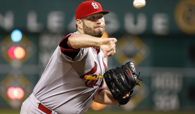 FILE - In this Sept. 28, 2015, file photo, St. Louis Cardinals starting pitcher Lance Lynn (31) warms up before the first inning of a baseball game against the Pittsburgh Pirates in Pittsburgh. After a watching its team ERA balloon from a National-League best 2.94 in 2015 to 4.08 last season, St. Louis knows its starting rotation must improve this year if they hope to catch the Chicago Cubs. The Cardinals believe they have the arms to do that, thanks to the return of a healthy Lance Lynn, a rejuvenated Michael Wacha and a full season from promising rookie Alex Reyes.   (AP Photo/Gene J. Puskar, File)