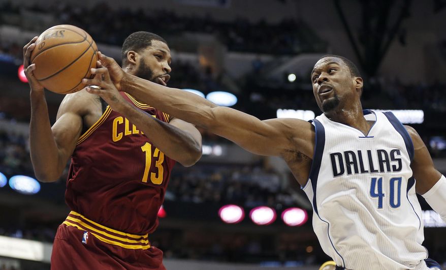 Cleveland Cavaliers forward Tristan Thompson (13) and Dallas Mavericks forward Harrison Barnes (40) battle for a rebound during the second half of an NBA basketball game, Monday, Jan. 30, 2017, in Dallas. Dallas won 104-97. (AP Photo/Brandon Wade)