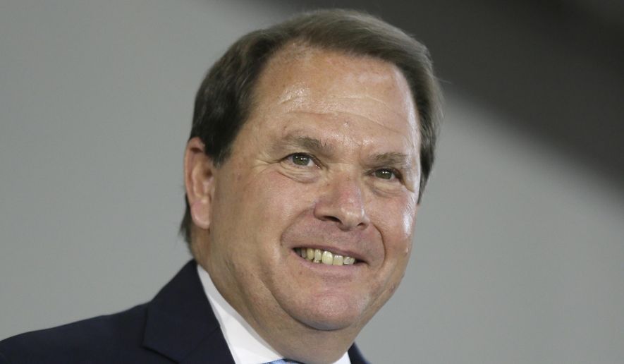 FILE- This June 20, 2014, file photo, Chief U.S. District judge Gerald Rosen shows after Michigan Gov. Rick Snyder signed legislation to provide state funding for Detroit municipal pensions as part of city's bankruptcy process in Detroit. Rosen is retiring from the federal bench Tuesday, Jan. 31, 2017, and opening a Judicial Arbitration and Mediation Services branch in Detroit on Wednesday, Feb. 1, 2017. (AP Photo/Carlos Osorio, File)