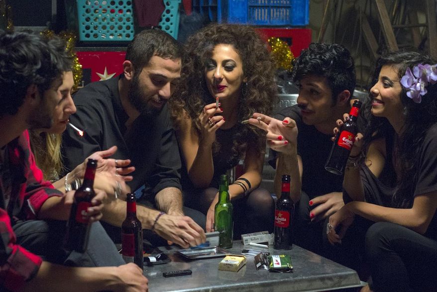 This undated handout photo provided by Deux Beaux Garcon Films shows a scene from the movie "In Between", the new award-winning film about Arab women battling their conservative society has touched off a real-life battle: the municipality of a major Arab city in Israel has called for a boycott of the film, and the film's director says she has received death threats for her unflinching portrayal of sex, drugs, parties, homosexuality and rape in her community. (Itay Gross, Deux Beaux Garcon Films via AP)