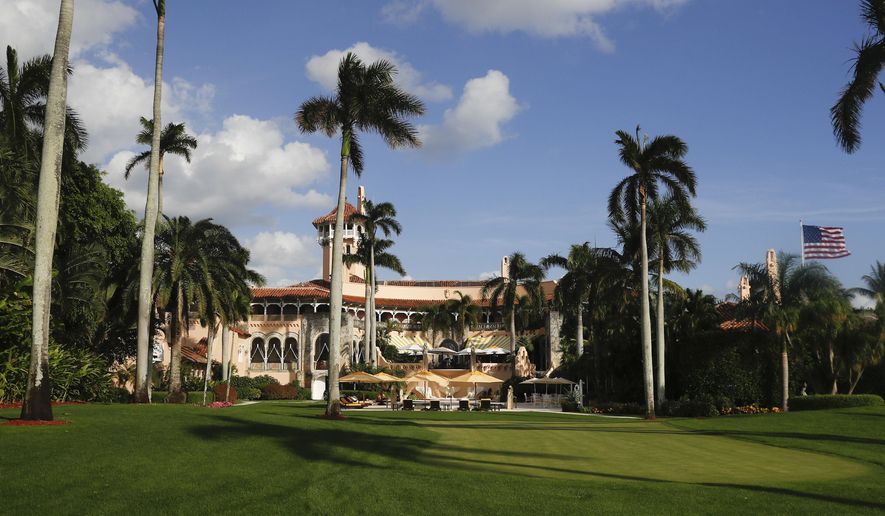 FILE - In this Nov. 27, 2016 file photo, Mar-a-Lago is seen from the media van window in Palm Beach, Fla. The Red Cross may have to contend with the elephant in the room, and protesters outside, when it holds its annual fundraiser this weekend at President Donald Trump’s Mar-a-Lago resort.  (AP Photo/Carolyn Kaster, File)
