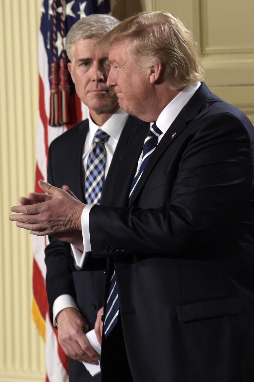 President Donald Trump claps after announcing 10th U.S. Circuit Court of Appeals Judge Neil Gorsuch as his choice for Supreme Court Justice during a televised address from the East Room of the White House in Washington, Tuesday, Jan. 31, 2017. (AP Photo/Susan Walsh)