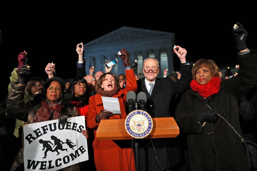 A protest rally on the steps of the Supreme Court by the Democratic leadership turned into a bit of an embarrassment Monday evening when House Minority Leader Nancy Pelosi (center) couldn't get her mic to work, leading to an impromptu hymn singing. (Associated Press)