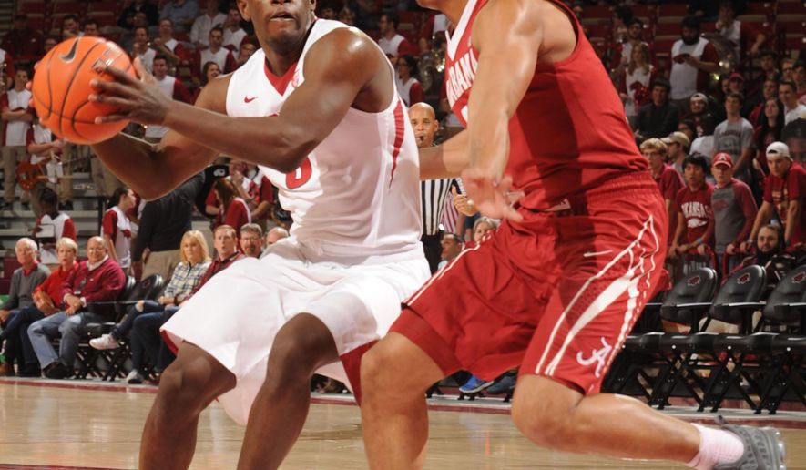 Arkansas guard Jaylen Barford, left, drives against Alabama guard Dazon Ingram during the first half of an NCAA college basketball game Wednesday, Feb. 1, 2017, in Fayetteville, Ark. (Andy Shupe/The Northwest Arkansas Democrat-Gazette via AP)