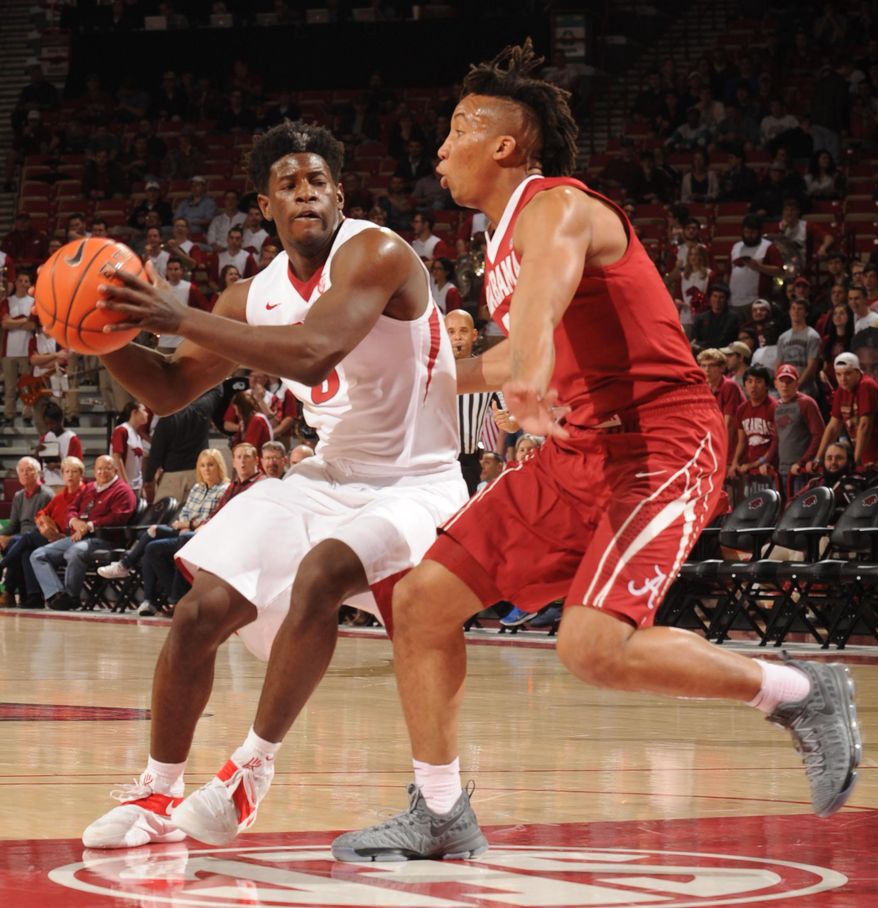 Arkansas guard Jaylen Barford, left, drives against Alabama guard Dazon Ingram during the first half of an NCAA college basketball game Wednesday, Feb. 1, 2017, in Fayetteville, Ark. (Andy Shupe/The Northwest Arkansas Democrat-Gazette via AP)
