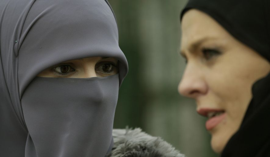 Bosnian Muslim women talk during events to observe World Hijab Day, celebrating the veil traditionally worn by Muslim women, in Sarajevo, Bosnia, on Wednesday, Feb. 1, 2017.  World Hijab Day was initiated in New York in 2013 and has since attracted interest around the world. (AP Photo/Amel Emric)