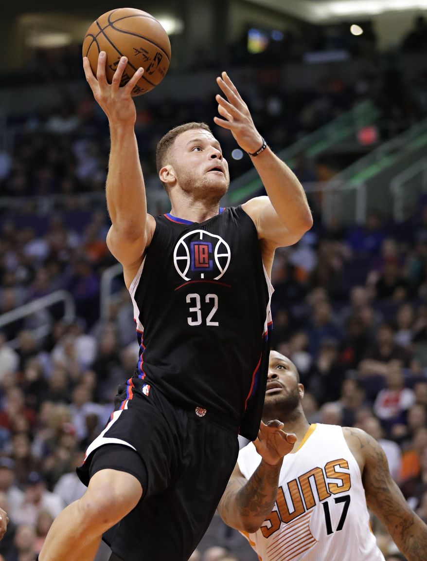 Los Angeles Clippers forward Blake Griffin (32) drives past Phoenix Suns forward P.J. Tucker (17) during the first half of an NBA basketball game, Wednesday, Feb. 1, 2017, in Phoenix. (AP Photo/Matt York)
