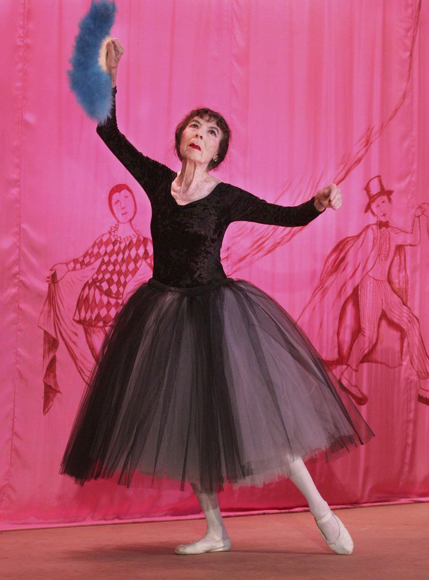 FILE - In this Oct 1, 2005 file photo, Marta Becket dances "en pointe" during the inaugural performance of "Masquerade" at the Amargosa Opera House in Death Valley Junction, Calif. Becket, a performance artist who spent decades presenting on one-woman shows at a remote Mojave Desert community hall that she transformed with paint brush and passion and made famous as the Amargosa Opera House, died Monday, Jan. 30, 2017, at her home. She was 92. (Sam Morris/The Las Vegas Sun via AP, File)