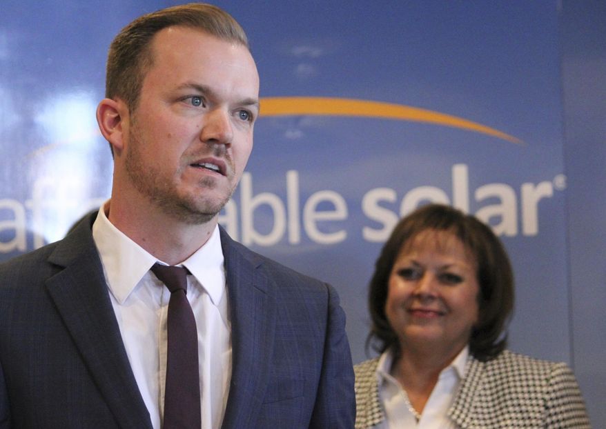 Affordable Solar president Kevin Bassalleck talks about the full-time positions his company will create as Gov. Susana Martinez listens during a news conference in Albuquerque, N.M., on Wednesday, Feb. 1, 2017. The new jobs stems from a $45 million solar project being developed by Public Service Co. of New Mexico to power the data center being built by social media giant Facebook. (AP Photo/Susan Montoya Bryan)