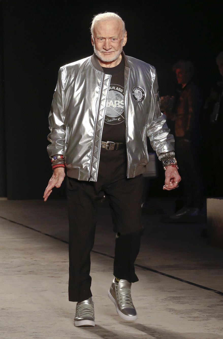 Astronaut Buzz Aldrin walks the runway during the unveiling of a Mars-themed fashion collection from designer Nick Graham, at men's Fashion Week, Tuesday, Jan. 31, 2017, in New York. (AP Photo/Bebeto Matthews)