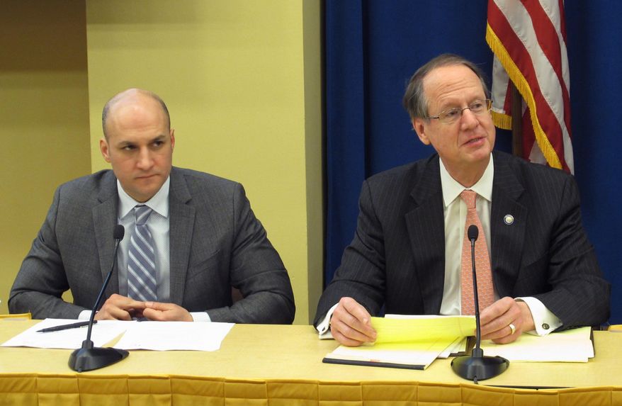 Ohio Senate Finance Chairman Scott Oelslager, right, talks about upcoming budget priorities, as Senate minority leader Joe Schiavoni listens in, on Wednesday, Feb. 1, 2017, in Columbus, Ohio. Lawmakers discussed the budget and other issues at an annual political forum sponsored by The Associated Press. (AP Photo/Andrew Welsh-Huggins)
