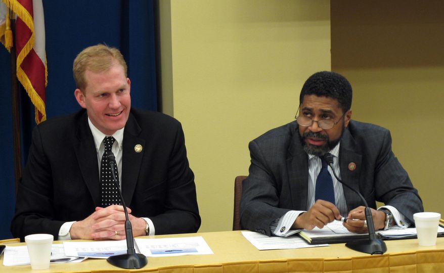 House minority Leader Fred Strahorn, right, talks about Democrats' budget priorities on a panel with House Finance Chairman Ryan Smith, on Wednesday, Feb. 1, 2017, in Columbus, Ohio. Lawmakers spoke at an annual political forum sponsored by The Associated Press. (AP Photo/Andrew Welsh-Huggins)