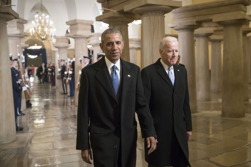President Barack Obama and Vice President Joe Biden walk through the Crypt of the Capitol in Washington, Friday, Jan. 20, 2017, for Donald Trump&#x27;s inauguration ceremony. (AP Photo/J. Scott Applewhite, Pool)