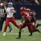 FILE - In this Dec. 19, 2015, file photo, Westlake quarterback Sam Ehlinger (4) rolls out looking for a receiver as North Shore&#39;s Leandre Dever (34) and Noah Campbell (40) apply pressure during the Texas UIL 6A Division I state championship football game in Houston. The Longhorns’ situation is similar to Georgia’s, with Ehlinger stepping in behind a freshman starter. The difference is new coach Tom Herman recruited Ehlinger not Steve Buechele and Ehlinger’s mobility could be a better fit in the offense. (AP Photo/Bob Levey, File)