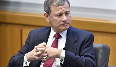 Chief Justice John Roberts listens to a question from during panel discussion at the The John G. Heyburn II Initiative and University of Kentucky College of Law&#39;s judicial conference and speaker series, Wednesday, Feb. 1, 2017, in Lexington, Ky. (AP Photo/Timothy D. Easley)