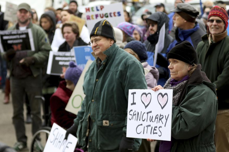 Hundreds attend an immigrant and refugee rights rally, in response to President Trump's ban on people entering the United States from seven Muslim-majority countries, at the Oregon State Capitol in Salem on Wednesday, Feb. 1, 2017. (Anna Reed /Statesman-Journal via AP)
