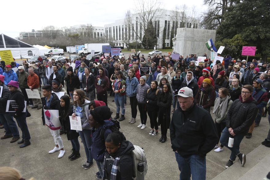 Hundreds attend an immigrant and refugee rights rally, in response to President Trump's ban on people entering the United States from seven Muslim-majority countries, at the Oregon State Capitol in Salem, Ore., on Wednesday, Feb. 1, 2017. (Anna Reed /Statesman-Journal via AP)