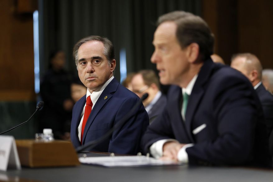 Veterans Affairs Secretary-designate Dr. David Shulkin, currently undersecretary for health at the VA, listens at left as Sen. Pat Toomey, D-Pa. introduces him on Capitol Hill in Washington, Wednesday, Feb. 1, 2017, at his confirmation hearing before the Senate Veterans' Affairs Committee. (AP Photo/Alex Brandon)