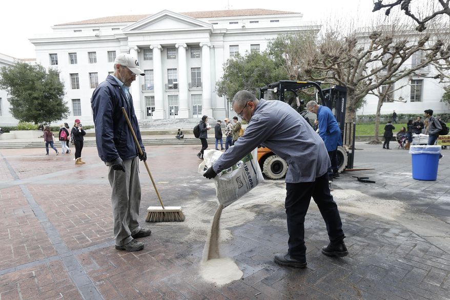 A work crew cleans up the remains of a charred portable light on the University of California, Berkeley campus in Berkeley, Calif., Thursday, Feb. 2, 2017. The University of California, Berkeley has become a campus renowned for peace and openness where all viewpoints are welcome. It was anything but that on Wednesday night when violence and rioting forced the cancellation of a talk by right-wing provocateur Milo Yiannopoulos. A spokesman for the campus said it was "not a proud night" for the birthplace of the Free Speech Movement. (AP Photo/Jeff Chiu)