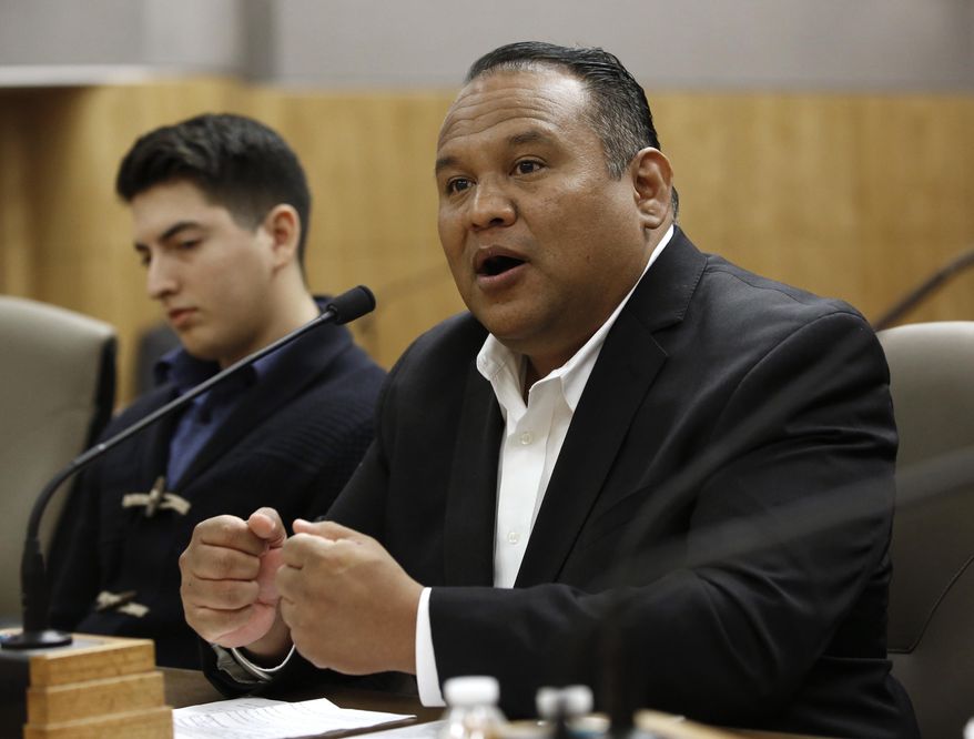 Santa Ana City Councilman Sal Tinajero, right, urges lawmakers to approve a proposed bill to prohibit local law enforcement from cooperating with federal immigration authorities, during a hearing of the Senate Public Safety Committee, Tuesday, Jan. 31, 2017, in Sacramento, Calif. The committee passed SB54, by Senate President Pro Tem Kevin de Leon, D-Los Angeles, that if approved by the Legislature and signed by the governor, could create a border-to-border sanctuary in the nation's largest state. (AP Photo/Rich Pedroncelli)
