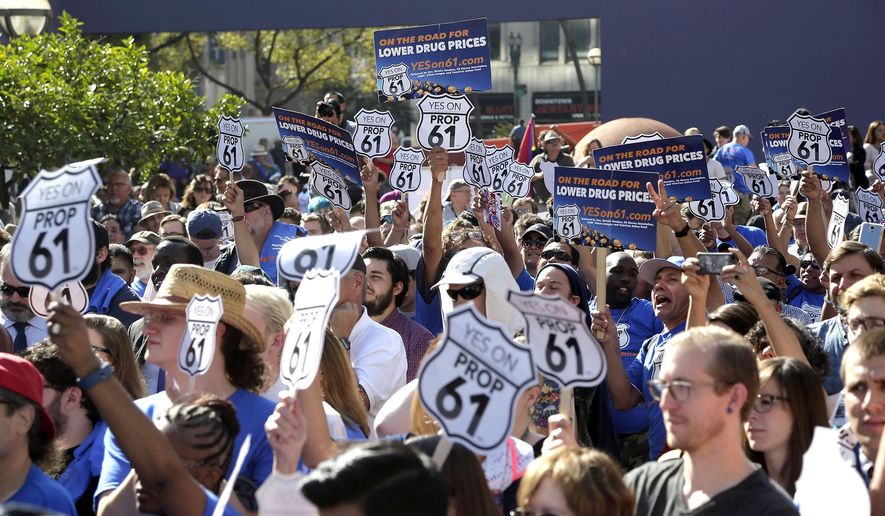 FILE - In this Nov. 7, 2016, file photo, Proposition 61 backers attend a rally supporting the proposition in downtown Los Angeles. Campaign committees raised a record $466 million to influence proposals on the 2016 ballot in California from legalizing marijuana to limiting prescription drug prices, according to an Associated Press analysis of campaign finance documents. Pharmaceutical companies spent more than $109 million in a successful effort to defeat the prescription drug pricing measure Proposition 61. (AP Photo/Nick Ut, File)