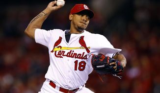FILE - In this Sept. 30, 2016, file photo, St. Louis Cardinals starting pitcher Carlos Martinez throws during the first inning of a baseball game against the Pittsburgh Pirates in St. Louis. The  Cardinals and Martinez have agreed to a $51 million, five-year contract extension that buys out his arbitration years and includes two team options, according a person direct knowledge of the deal. The person spoke Thursday, Feb. 2, 2017,  on condition of anonymity because terms have not been released. (AP Photo/Billy Hurst, File)