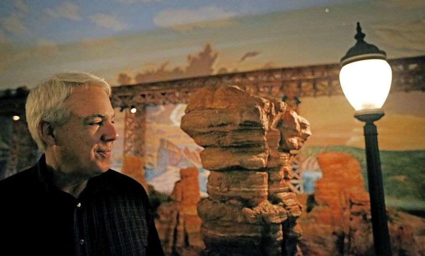 ADVANCE FOR MONDAY, FEB. 6, 2017 - In this Wednesday, Jan. 25, 2017 photo, railroad museum director Bob LaPrelle views the model train display built by Jane and Stephen Sanders in their Dallas home. (Louis DeLuca/The Dallas Morning News via AP)