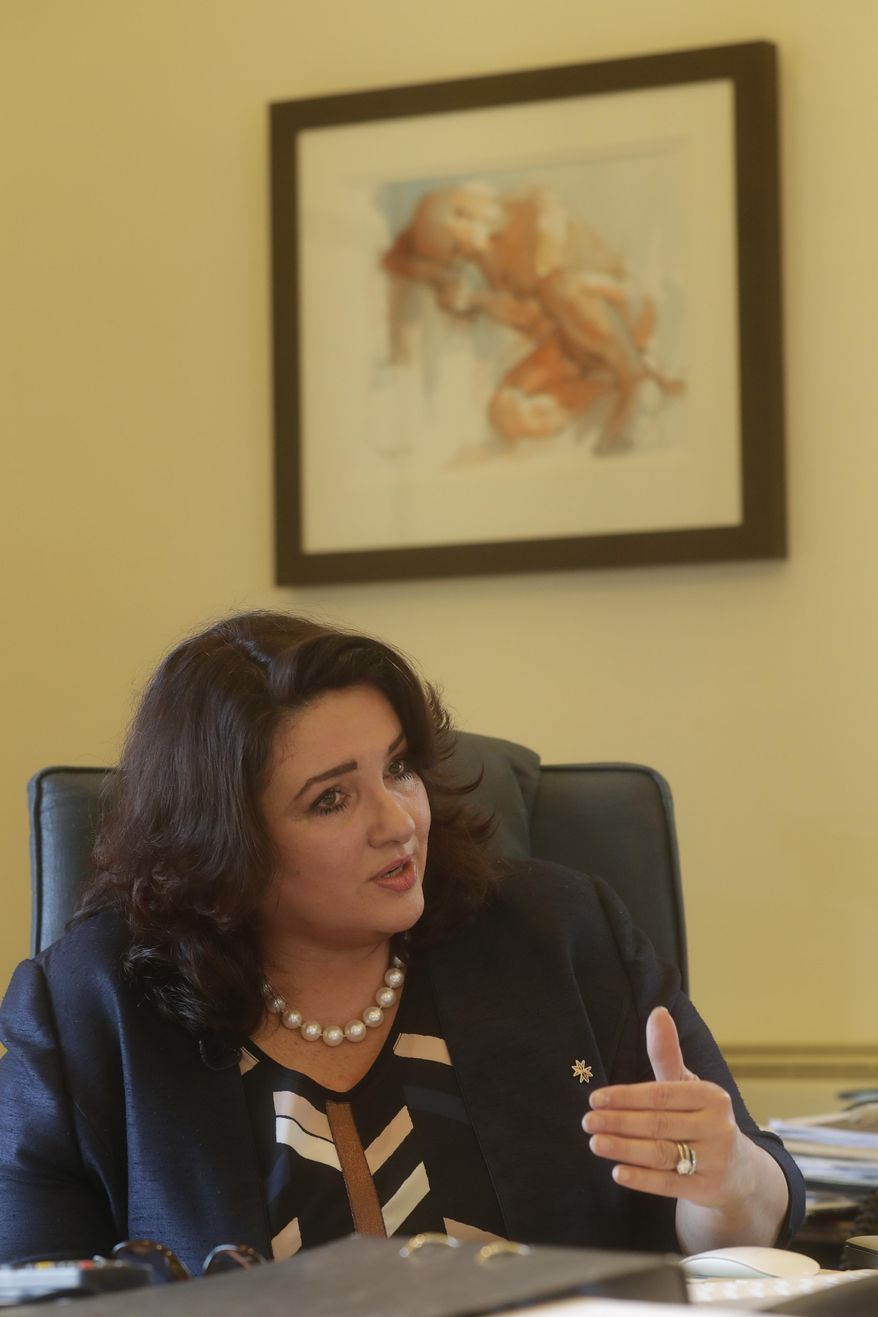 Maltese Minister for Social Dialogue Consumer Affairs and Civil Liberties Helena Dalli speaks during an interview with the Associated Press, in Valletta, Wednesday, Feb. 1, 2017. After a quarter-century as Malta's governing party, the conservative Nationalist Party scrambled to line up a transgender young man as a candidate for next year's Parliamentary elections in hopes of reversing a stinging, landslide 2013 loss to its socialist archrivals who came to power with an agenda heavy on LGBT rights. (AP Photo/Gregorio Borgia)