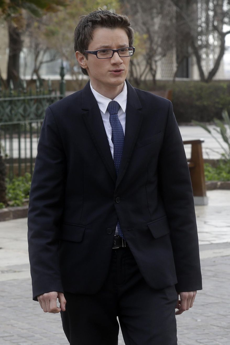 Alex Mangion arrives for an interview with the Associated Press, in Valletta, Wednesday, Feb. 1, 2017. Lithe and dapper in a navy-blue suit as he gazed at this capital city's storied Grand Harbor, Alex Mangion proudly described becoming Malta's first transgender politician, winning a local office on the conservative Nationalists' ticket in a country that until just a few years ago had been a last bastion in Western Europe of social norms largely dictated by the Catholic church. (AP Photo/Gregorio Borgia)