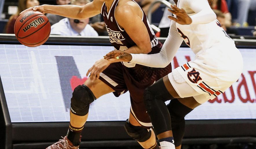 Mississippi State guard Dominique Dillingham (00) dribbles around Auburn guard Janiah McKay, right, during the first half of an NCAA college basketball game, Thursday, Feb. 2, 2017, in Auburn, Ala. (AP Photo/Butch Dill)