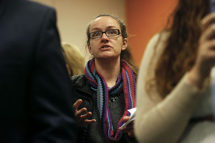 Springfield resident Lexi Amos asks Missouri Gov. Eric Greitens a question about MedicAid block grants and school vouchers following his delivery of an outline of the his state budget for fiscal year 2018 during an address at Nixa's Early Childhood Center inNixa, Mo., Thursday, Feb. 2, 2017. (Guillermo Hernandez Martinez /The Springfield News-Leader via AP)