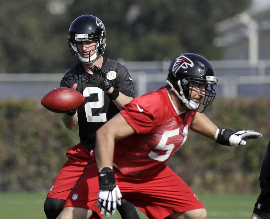 Atlanta Falcons quarterback Matt Ryan (2) takes a snap from center Alex Mack (51) during a practice for the NFL Super Bowl 51 football game Thursday, Feb. 2, 2017, in Houston. Atlanta will face the New England Patriots in the Super Bowl Sunday. (AP Photo/Eric Gay)