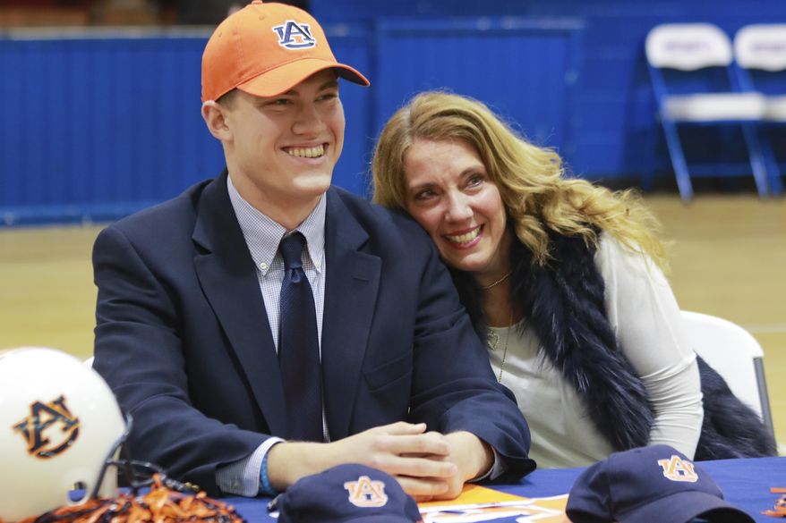 Bill Taylor smiles after signing to play for Auburn University on Wednesday, Feb. 1, 2017, at the American Christian Academy in Tuscaloosa, Ala. (Jake Arthur/The Tuscaloosa News via AP)