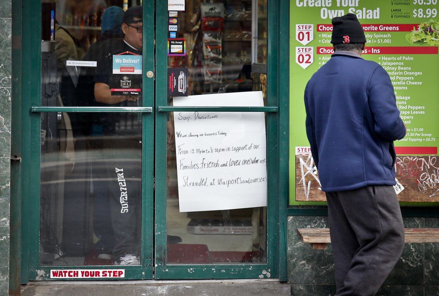 A sign posted on the closed doors of a deli owned by Haron Zokari, a Yemeni immigrant, alert customers that the store will close because of a protest against President Donald Trump's travel ban, Thursday, Feb. 2, 2017, in New York. Yemeni business owners who operate corner bodegas and neighborhood delis shut them down on Thursday in protest of the travel ban on people hailing from seven Muslim-majority countries including Yemen. (AP Photo/Bebeto Matthews)