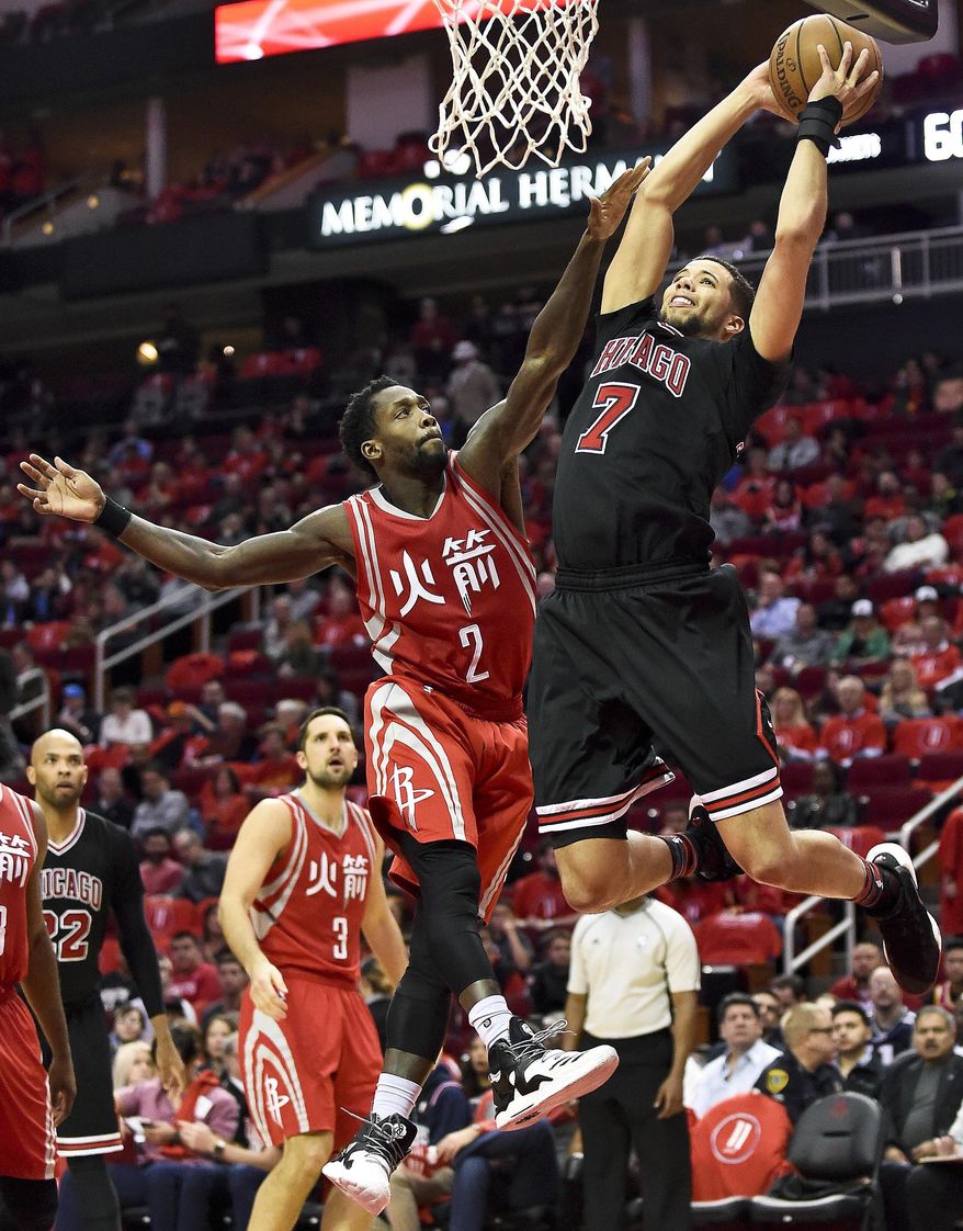 Chicago Bulls guard Michael Carter-Williams (7) shoots against Houston Rockets guard Patrick Beverley (2) during the second half of an NBA basketball game, Friday, Feb. 3, 2017, in Houston. Houston won 121-117. (AP Photo/Eric Christian Smith)