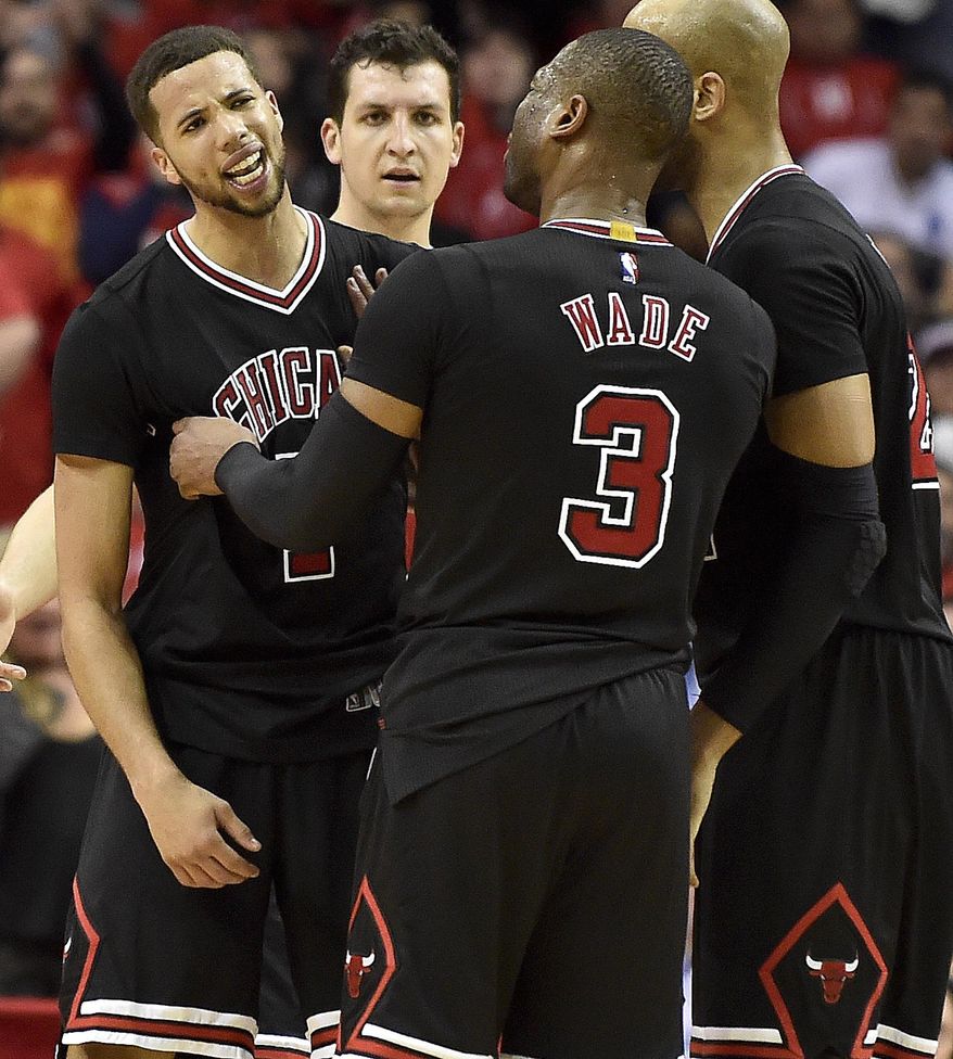 Chicago Bulls guard Michael Carter-Williams, left, reacts after fouling out during the second half of the team&#39;s NBA basketball game against the Houston Rockets, Friday, Feb. 3, 2017, in Houston. Houston won 121-117. (AP Photo/Eric Christian Smith)