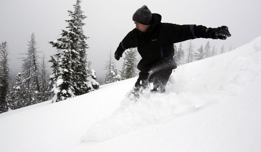 FILE - In this Feb. 6, 2014, file photo, Mark Morical carves through the heavy powder snow at the top of Vista Butte west of Bend, Ore. Some backcountry areas in Central Oregon are so accessible that it is hard to even consider them backcountry and Vista Butte is certainly one of those places. (Joe Kline/The Bulletin via AP, File)