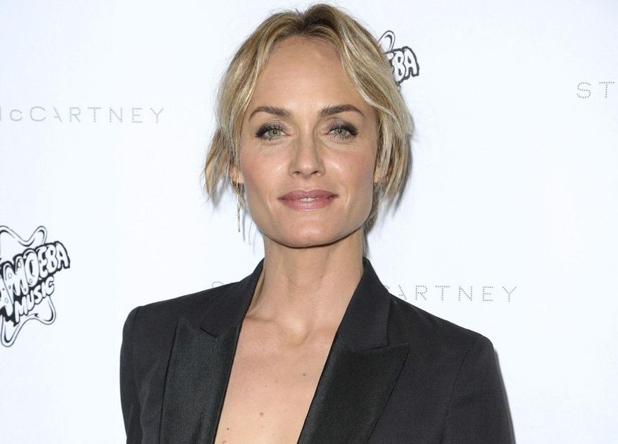 FILE - This Jan. 12, 2016 file photo shows Sierra Club Ambassador, model, actress and Oklahoma native Amber Valletta at the Stella McCartney Autumn 2016 Presentation in Los Angeles. Valletta authored a passionate op-ed piece released Friday, Feb. 3, 2017, on Glamour.com, opposing Oklahoma Attorney General Scott Pruitt&#39;s nomination to lead the Environmental Protection Agency.  (Photo by Rich Fury/Invision/AP, File)