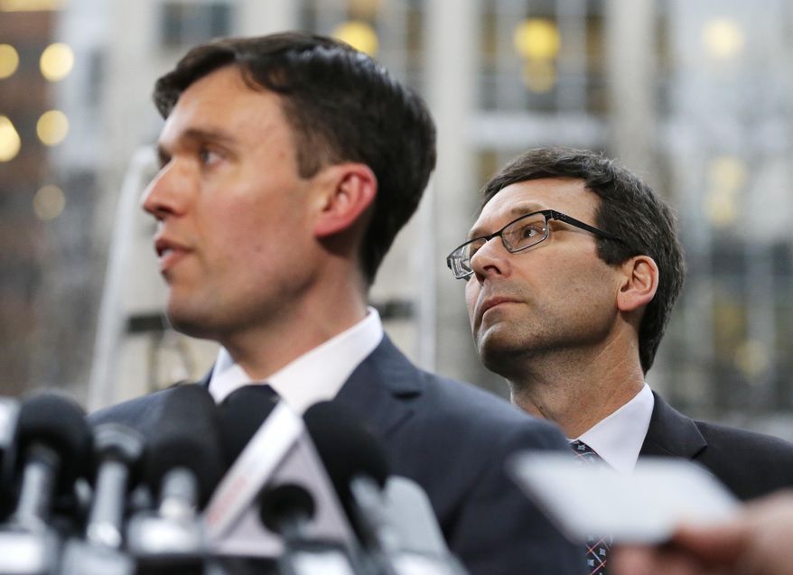 Washington state Solicitor General Noah Purcell, left, and Attorney General Bob Ferguson, right, listen to questions from reporters, following a hearing in federal court Friday, Feb. 3, 2017, in Seattle. A U.S. judge on Friday temporarily blocked President Donald Trump's ban on people from seven predominantly Muslim countries from entering the United States after Washington state and Minnesota urged a nationwide hold on the executive order that has launched legal battles across the country. (AP Photo/Ted S. Warren)