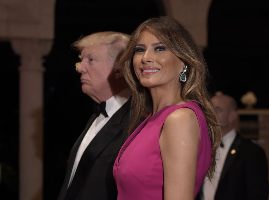 President Donald Trump and first lady Melania Trump arrive for the 60th annual Red Cross Gala at Trump's Mar-a-Lago resort in Palm Beach, Fla., Saturday, Feb. 4, 2017. (AP Photo/Susan Walsh)
