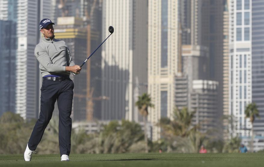 Henrik Stenson of Sweden plays a shot on the 13th hole during the second round completion of the Dubai Desert Classic golf tournament in Dubai, United Arab Emirates, Saturday, Feb. 4, 2017. (AP Photo/Kamran Jebreili)