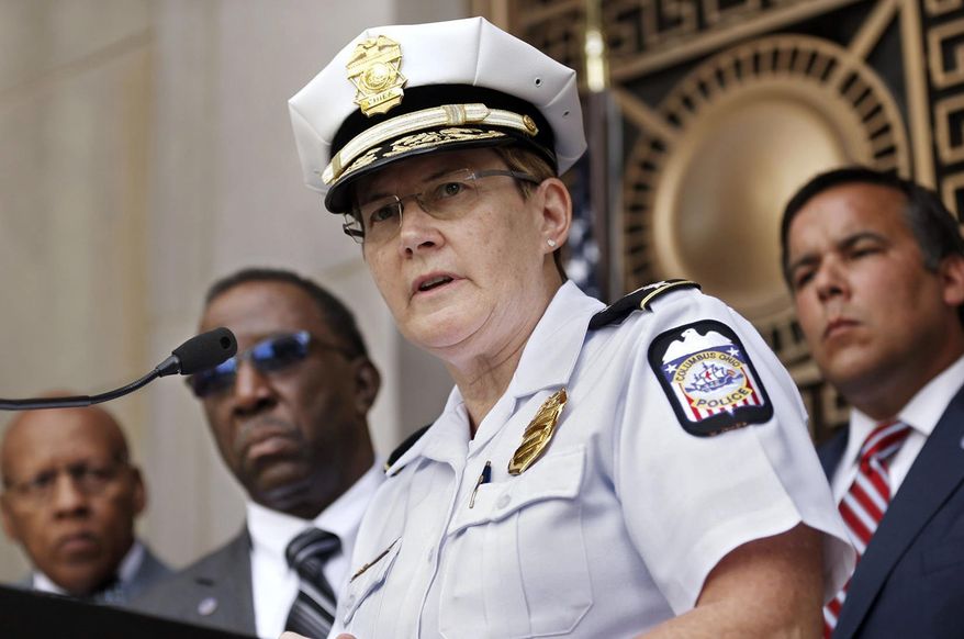 FILE - In this Sept. 15, 2016 file photo, Columbus Police Chief Kim Jacobs holds a news conference about the police shooting of a 13-year-old boy who pulled a BB gun from his waistband just before he was shot and killed by police investigating an armed robbery report, in Columbus, Ohio. Jacobs is among the growing number of women heading departments, many in need of image makeovers. (Fred Squillante/The Columbus Dispatch via AP, File)