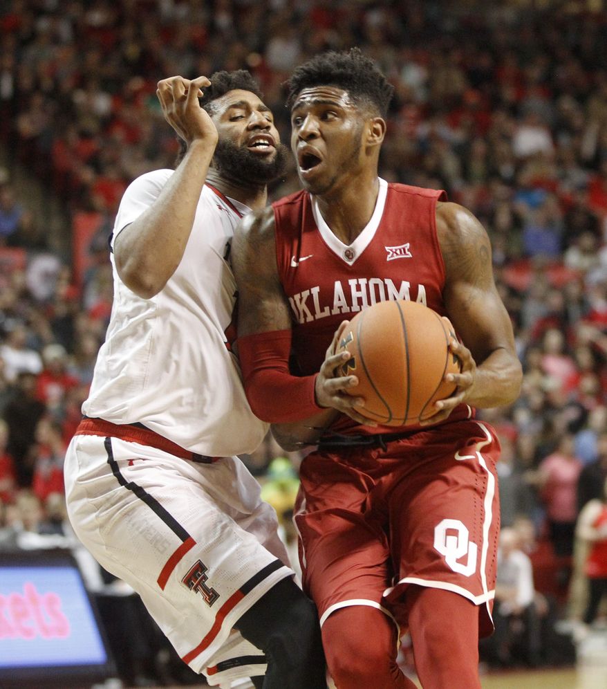 Oklahoma guard Rashard Odomes looks for a shot while defended by Texas Tech forward Aaron Ross during the first half of an NCAA college basketball game Saturday, Feb. 4, 2017, in Lubbock, Texas. (Mark Rogers/Lubbock Avalanche-Journal via AP)