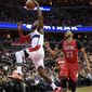 Washington Wizards guard John Wall (2) goes to the basket past New Orleans Pelicans forward Anthony Davis (23) during the second half of an NBA basketball game, Saturday, Feb. 4, 2017, in Washington. The Wizards won 105-91. (AP Photo/Nick Wass)